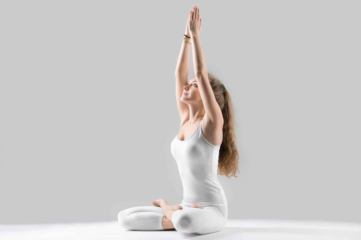 Young Attractive Woman Sitting Padmasana Pose Grey Studio Ba (1)